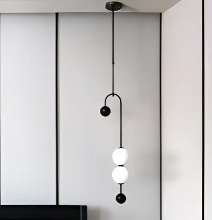 Decorbites black gold chandelier pendant featuring black metal frame with three white spherical glass globes in nordic style