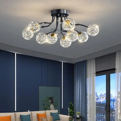 Decorbites black gold chandelier with modern black metal frame and clear glass globe shades featuring warm led lights