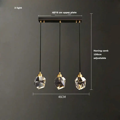 Modern three-light pendant lamp with black gold crystal globes and gold crystal chandelier accents by decorbites black gold