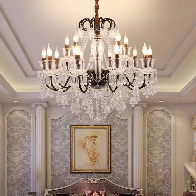 An ornate decorbites black gold pendant light with black metal arms and clear glass prisms for elegant living spaces