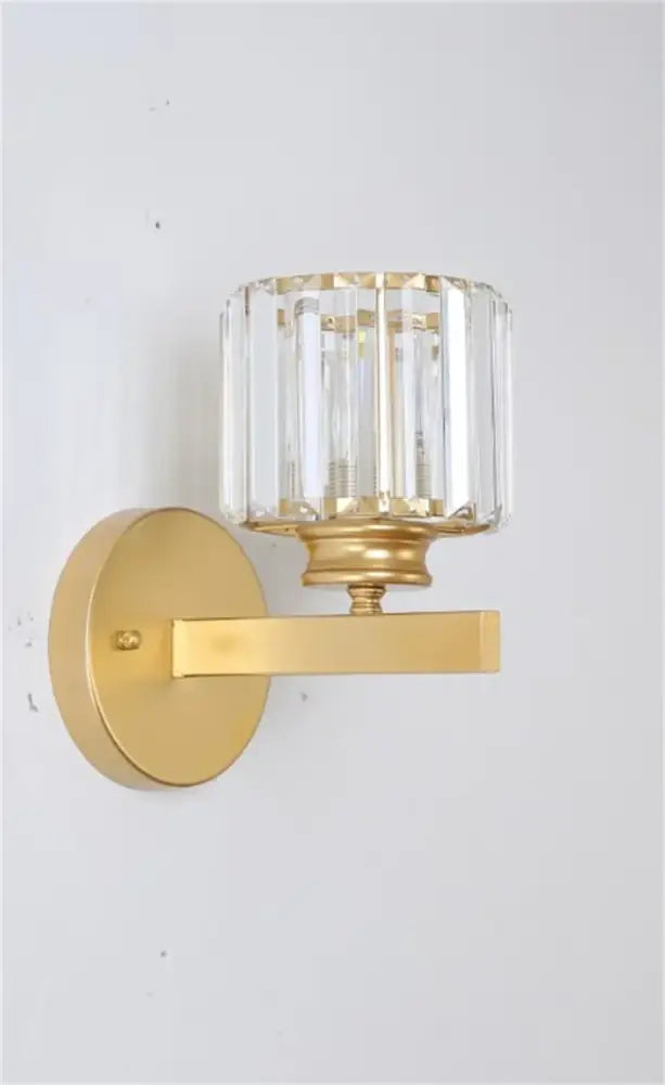 Decorbites black gold crystal wall light with gold finish and cylindrical crystal shade for bedroom living room use