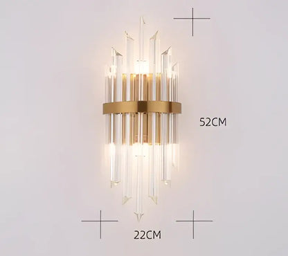 Gold-toned black gold crystal wall sconce by decorbites with clear crystal rods in a modern vertical cascading design