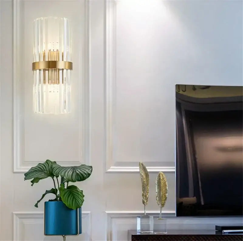 Gold-toned decorbites black gold crystal wall sconce with vertical rods and brass ring for bedroom living room lighting