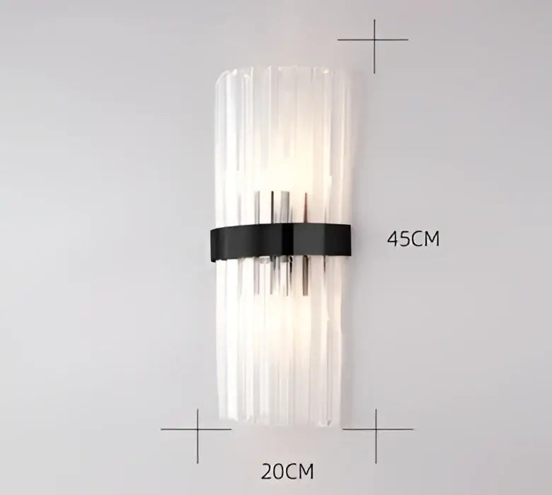 Modern black metal wall sconce with clear vertically ribbed glass panels for bedroom and living room décor by DecorBites