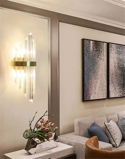 Decorbites™ black gold crystal wall sconce with vertical crystal prisms casting warm light for home décor