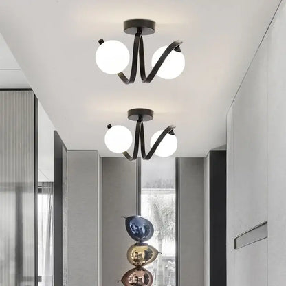 Modern minimalist decorbites black gold ceiling light with black metal and glowing white glass bulbs for indoor use