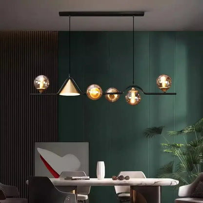 Modern black metal chandelier with five amber glass globes and one conical shade from decorbites black gold glass collection