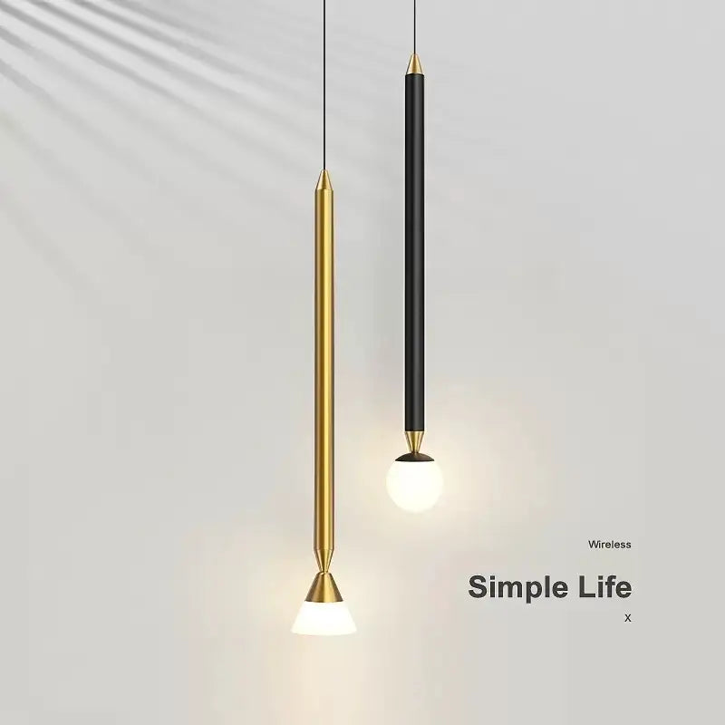 Two minimalist decorbites black gold pendant lights with cylindrical bodies and brass caps for bedroom sconces