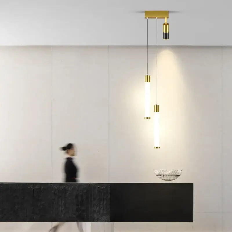 Modern minimalist DecorBites black gold pendant lamp with three cylindrical bulbs for bedroom and living room lighting