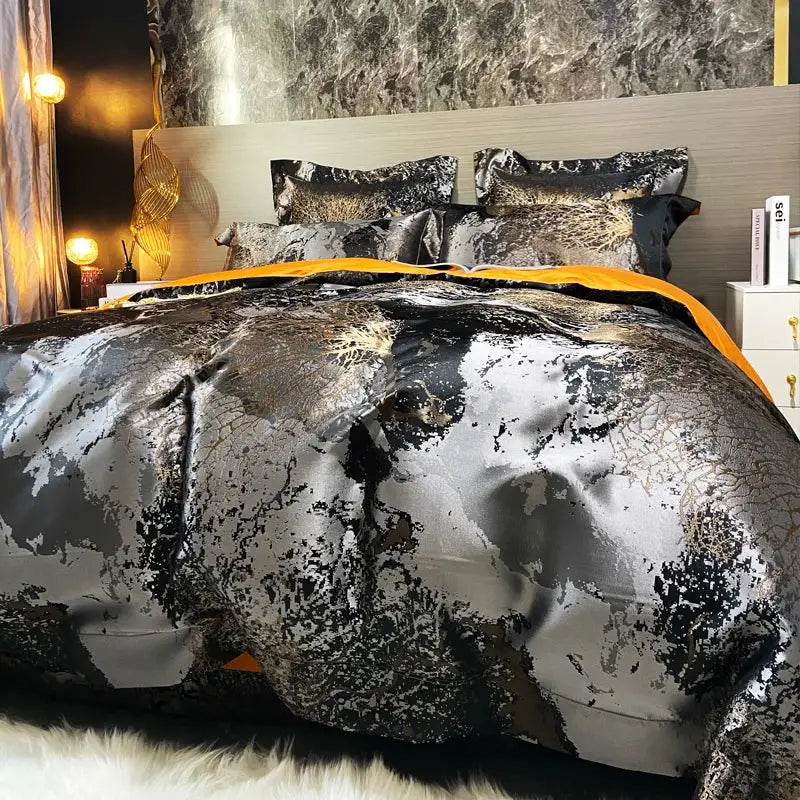 Luxury metallic black and silver decorbites black gold egyptian cotton bedding set with bold abstract pattern and orange trim