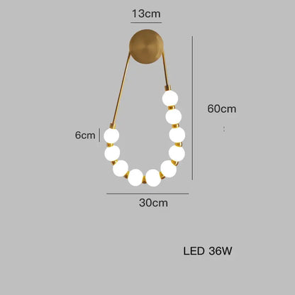 Gold-toned DecorBites black gold wall lamp with seven white LED bulbs in an elegant curved design for bedroom and corridor
