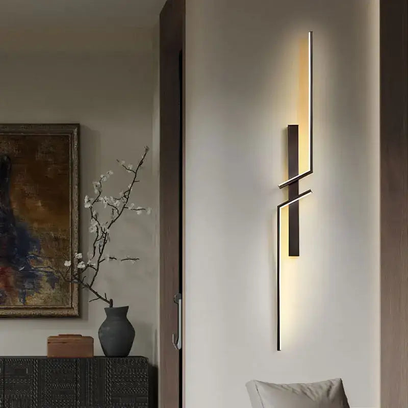 DecorBites black gold modern wall lights with sleek black metal arms and warm LED lighting for bedroom or stairs