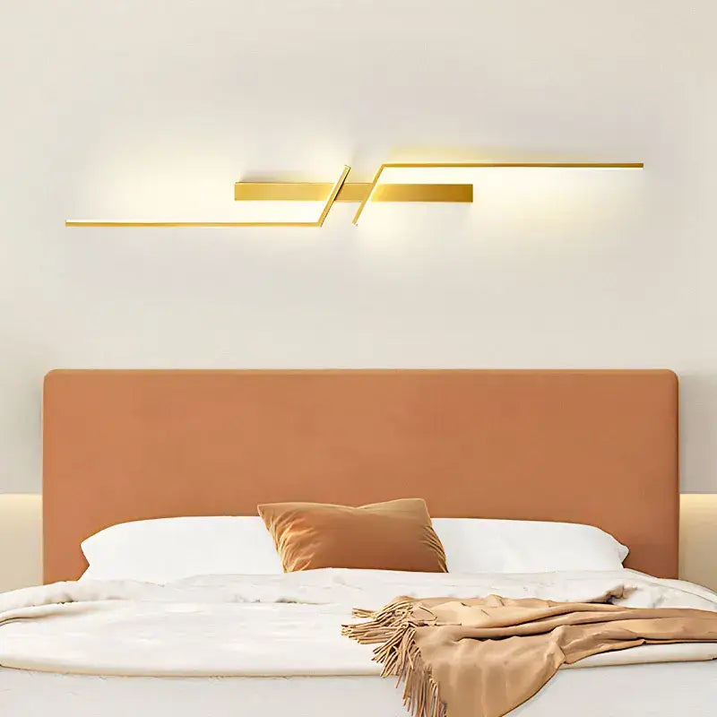 Modern gold-toned linear wall sconce with sleek geometric design by DecorBites black gold led wall lights for bedroom stairs