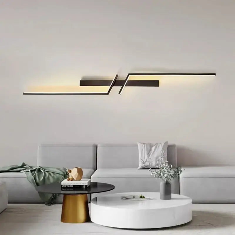 Modern minimalist DecorBites black gold led wall lights with sleek black metal arms for bedroom and TV background lighting