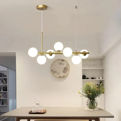Modern brass DecorBites black gold Nordic pendant chandelier with multiple white glass bulbs for dining and living rooms
