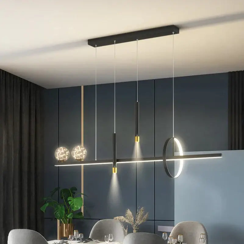 Modern black gold pendant lamp by DecorBites featuring a sleek linear design with spherical globe lights for dining room use