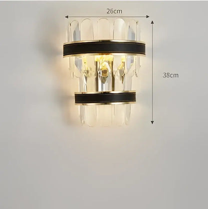 Modern wall sconce with clear crystal prisms and black leather-wrapped metal bands from DecorBites black gold round LED collection