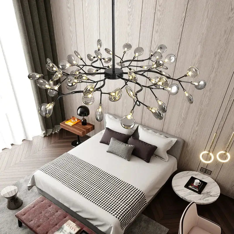 Decorbites black gold tree branch chandelier featuring modern black metal frame with clear glass teardrop bulbs for living room