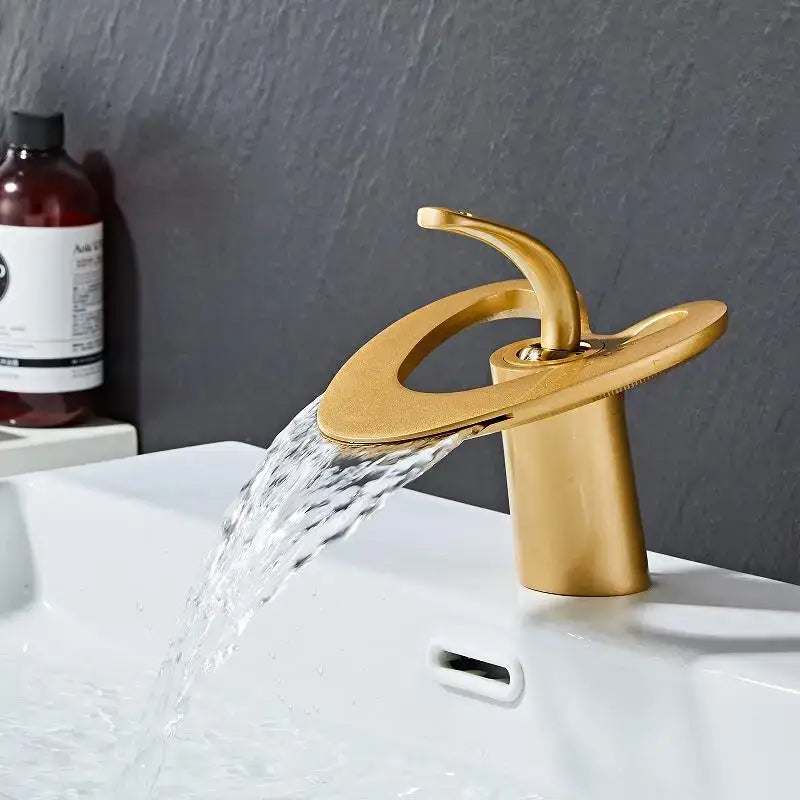 Decorbites™ gold waterfall basin faucet with sleek modern design and brushed metallic finish for hot cold mixer tap