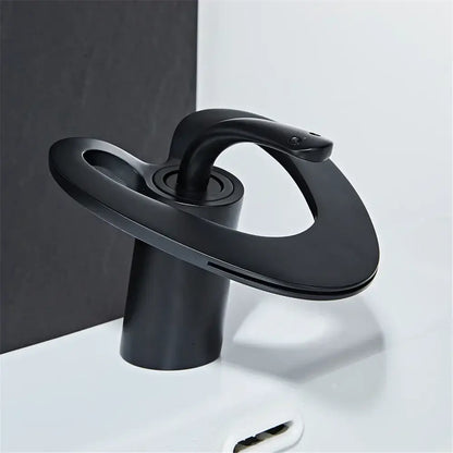 Decorbites black gray brass waterfall basin faucet in matte finish featuring modern sculptural design for hot cold mixing