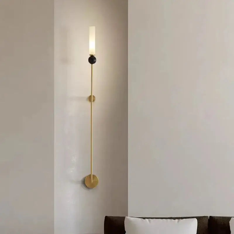 Decorbites™ black green marble wall lamp sconce with gold-toned rod, black accent, and copper acrylic lampshade emitting warm light