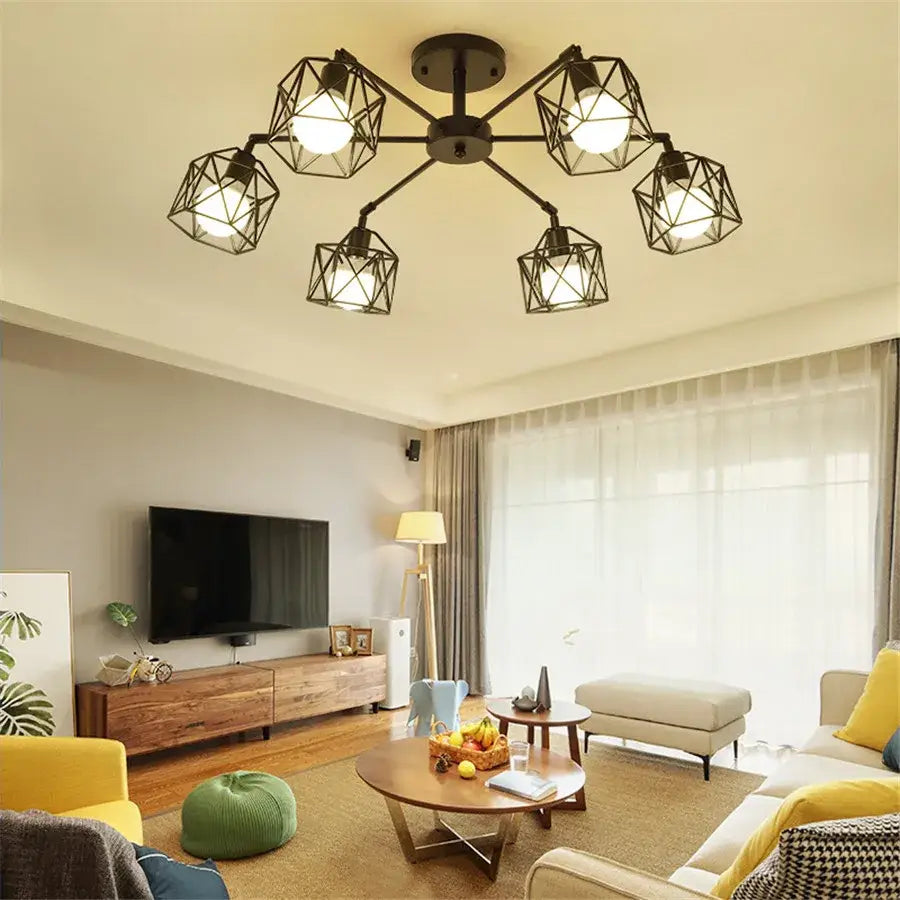 Decorbites black iron cage chandelier with geometric adjustable spider design and multiple exposed bulbs in black iron