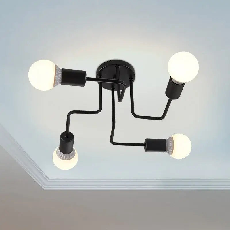 Decorbites black iron ceiling light with four exposed bulb sockets and curved arms for living and dining rooms