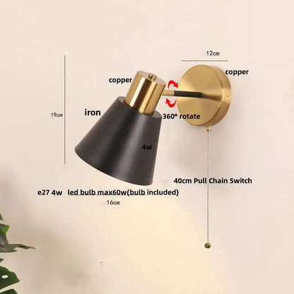 Modern adjustable decorbites black iron wall sconce with matte black iron shade copper accents and 360-degree rotating arm