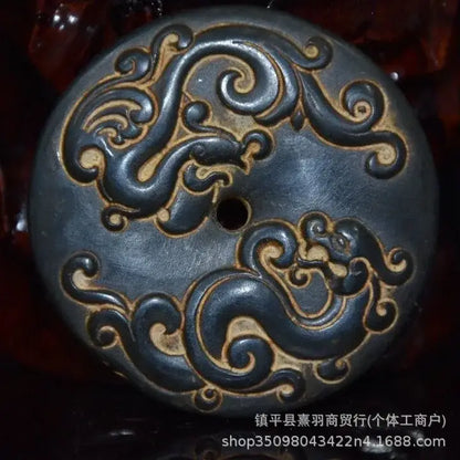 Dark blue ceramic button with gold embossed dragon pattern and central hole for decorbites black iron meteorite sun statue