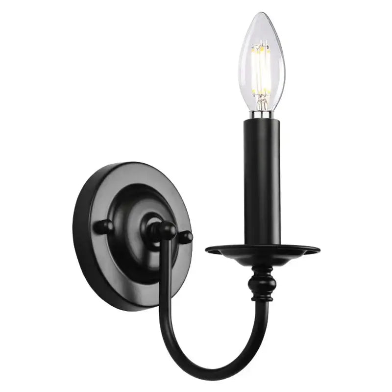 Decorbites black iron vintage wall lamp featuring a black wrought iron candle-style sconce with clear filament bulb
