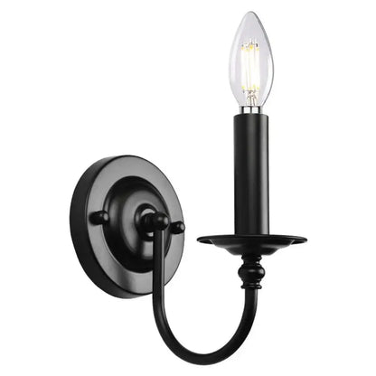 Decorbites black iron vintage wall lamp featuring a black wrought iron candle-style sconce with clear filament bulb
