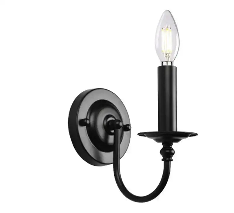 Decorbites black iron vintage wall lamp featuring a black wrought iron candle-style sconce with clear filament bulb
