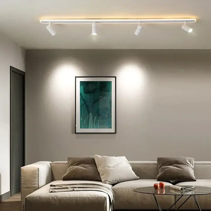 Modern white decorbites black led ceiling spotlights with four adjustable track lights above a beige sofa