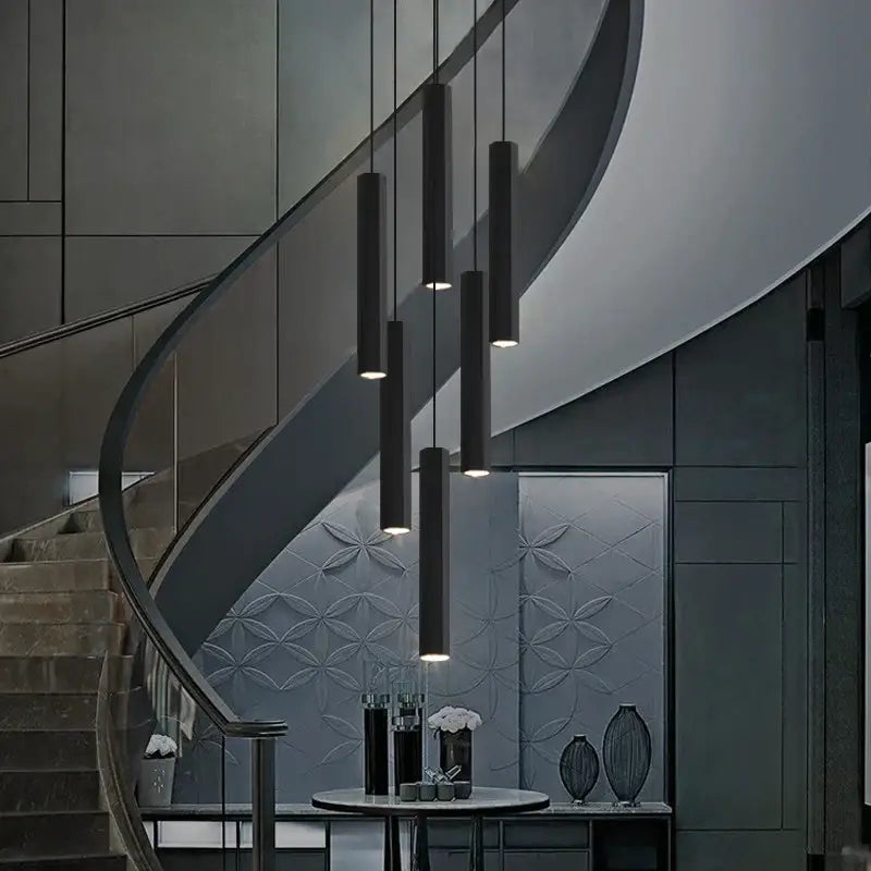 Modern decorbites black led crystal staircase chandelier with black cylindrical pendant lights in a sleek minimalist design