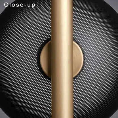 Gold-toned cylindrical lamp fixture with black perforated mesh shade on decorbites black led floor lamp for modern living rooms