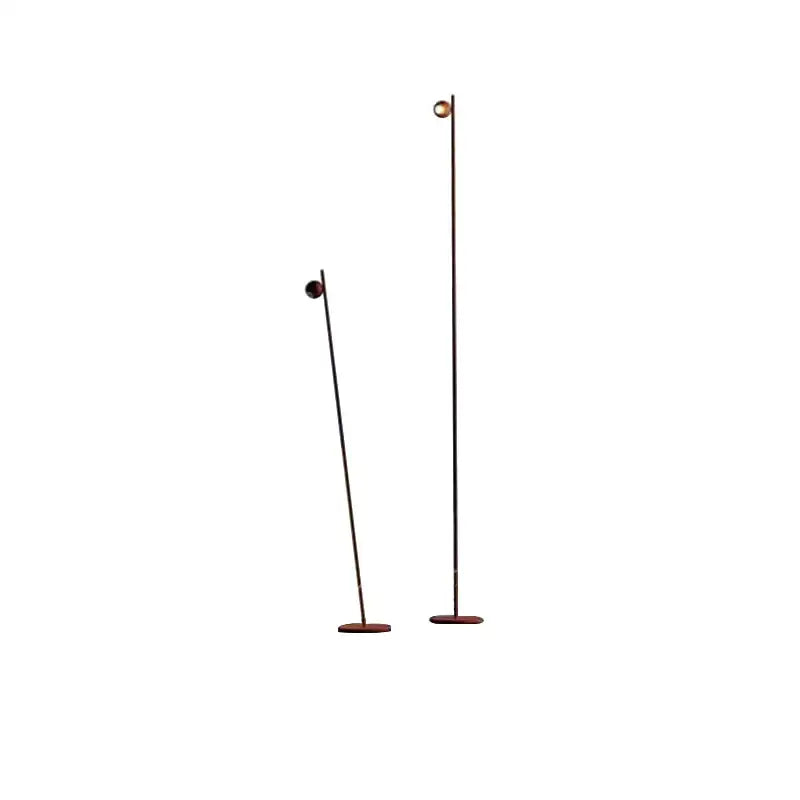 Two decorbites black led floor lamps with slender black metal poles and brass-finished globes on wooden bases