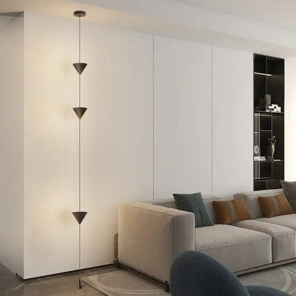 Modern minimalist black led pendant chandelier with three stacked triangular shades suspended by thin cables for Nordic decor