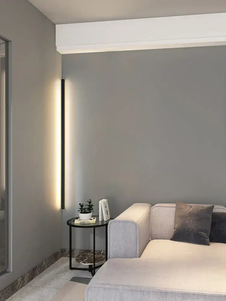 Modern minimalist vertical wall lamp with sleek black led frame and warm ambient lighting by DecorBites black led wall