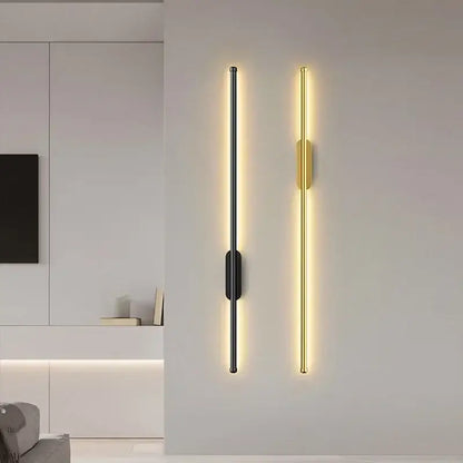 DecorBites™ black and gold led wall lights with sleek vertical strips emit warm ambient light for modern interiors