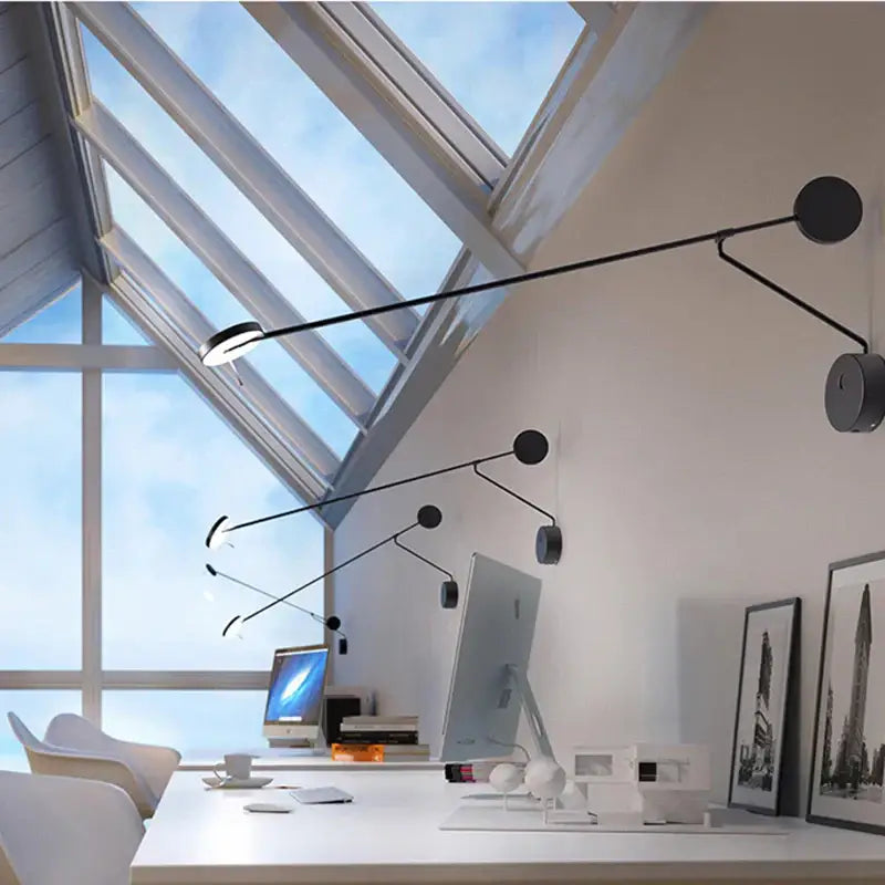 Decorbites black led wall reading light with minimalist black articulated arms and circular heads for bedroom office use