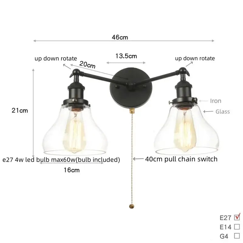 Black iron DecorBites black LED wall sconce with two adjustable arms and clear glass bell-shaped shades for bathroom mirror