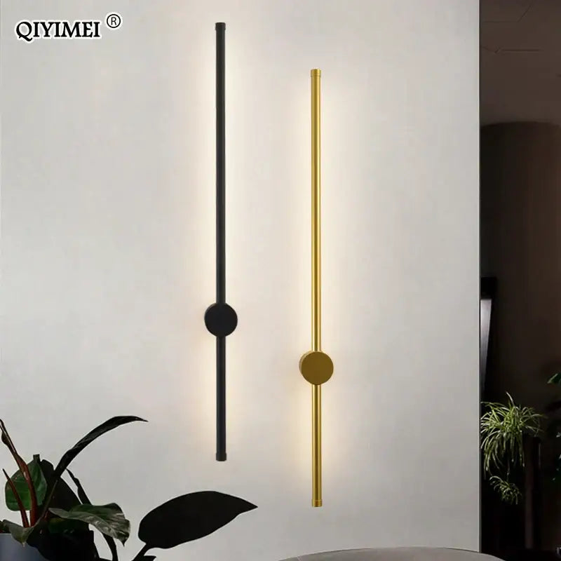 Modern minimalist decorbites black led wall sconce with sleek black and gold cylindrical body and circular accent light for living room lighting