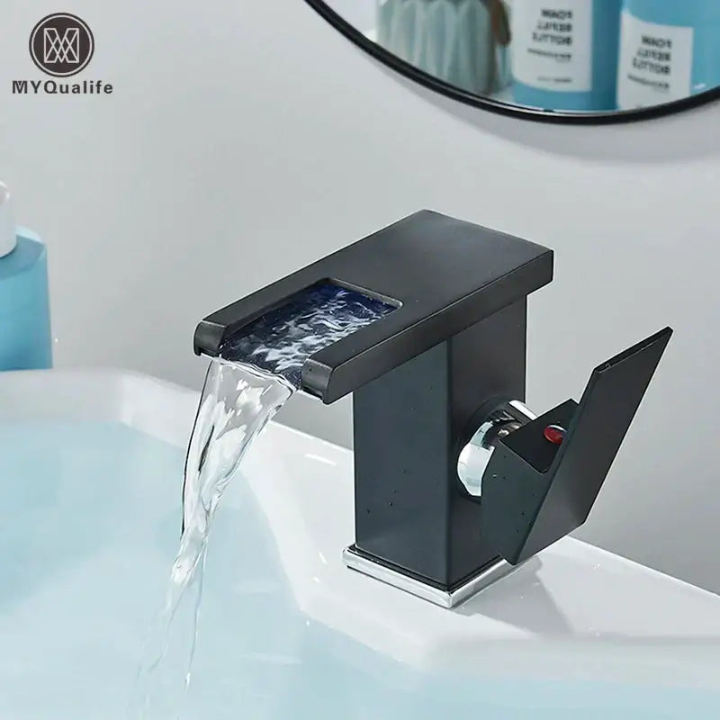 DecorBites black led waterfall bathroom faucet in black matte with chrome accents and three color change deck mounted design