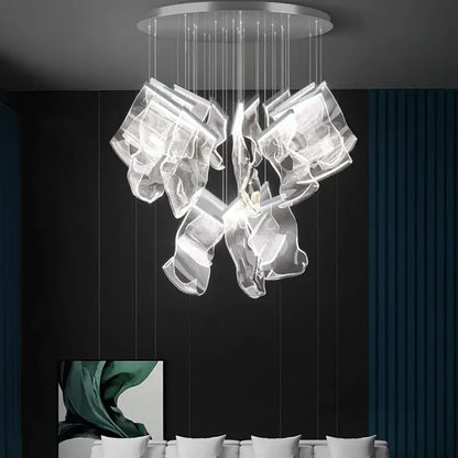 A modern decorbites black love chandelier featuring transparent glass and a sleek silver mount for dining room lighting