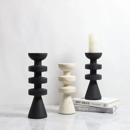 DecorBites™ black marble candle holder with stacked circular rings and a yellow stone conical base design