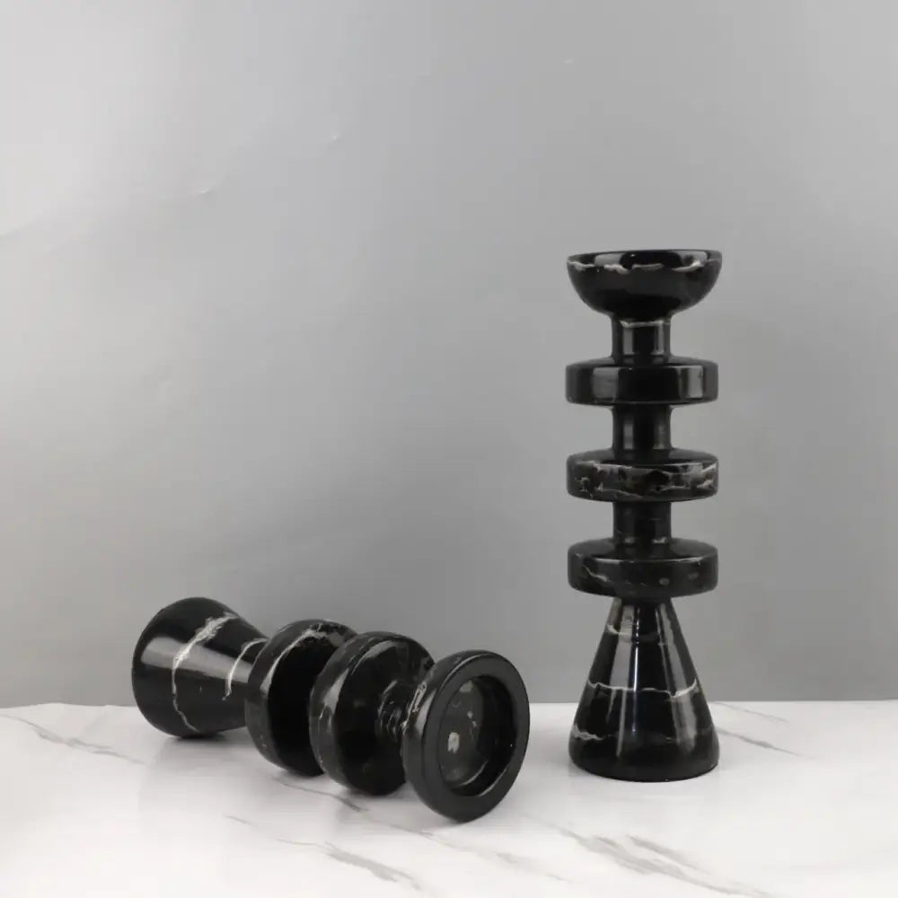 DecorBites™ black marble candle holder with sleek stacked rings and glossy finish complements modern yellow stone décor