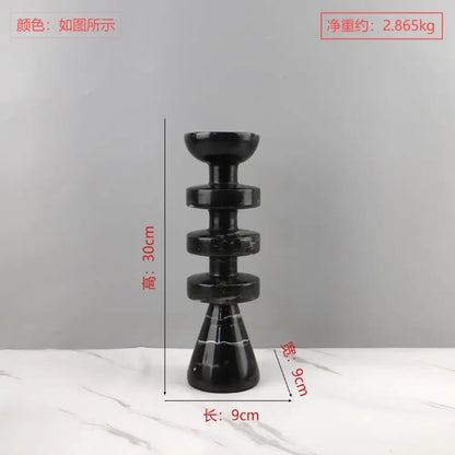 Decorbites black marble candle holder with stacked circular tiers and conical yellow stone base for modern decor