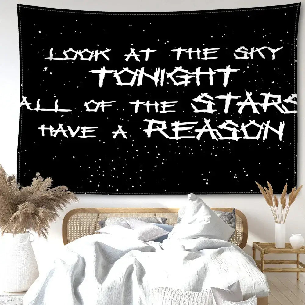 Decorbites black sky art tapestry featuring white distressed lettering on a black starry wall tapestry for bedroom decor