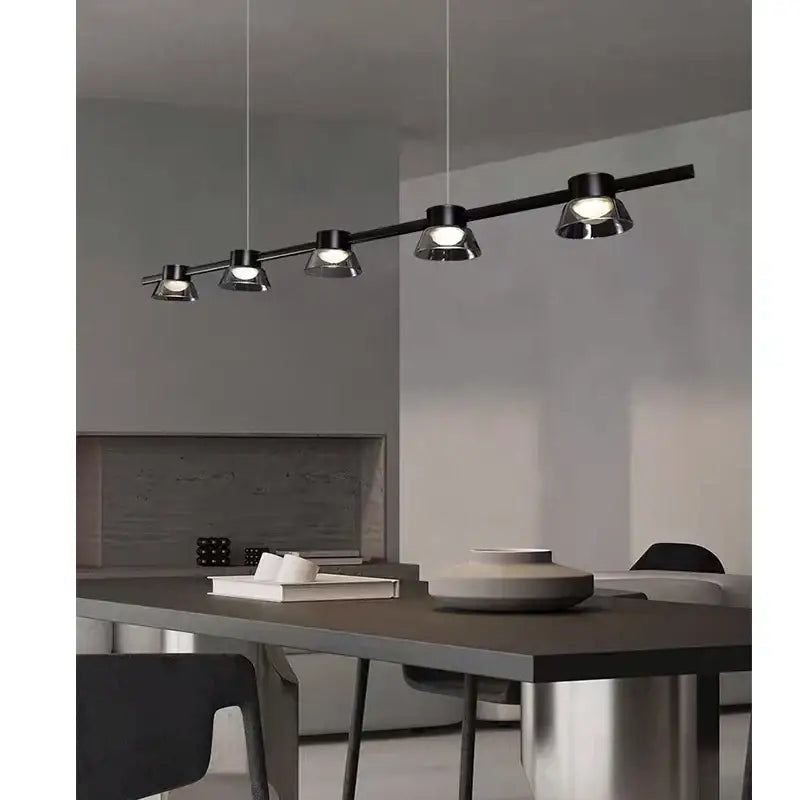 Decorbites black strip chandelier featuring a black modern pendant light with four adjustable spotlights for living room use