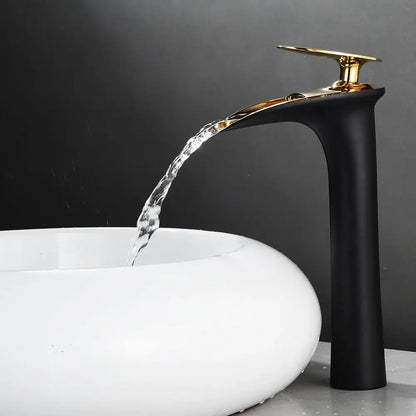 Decorbites™ black waterfall bathroom faucet mixer tap with gold-toned spout flowing water into white ceramic sink basin faucets modern